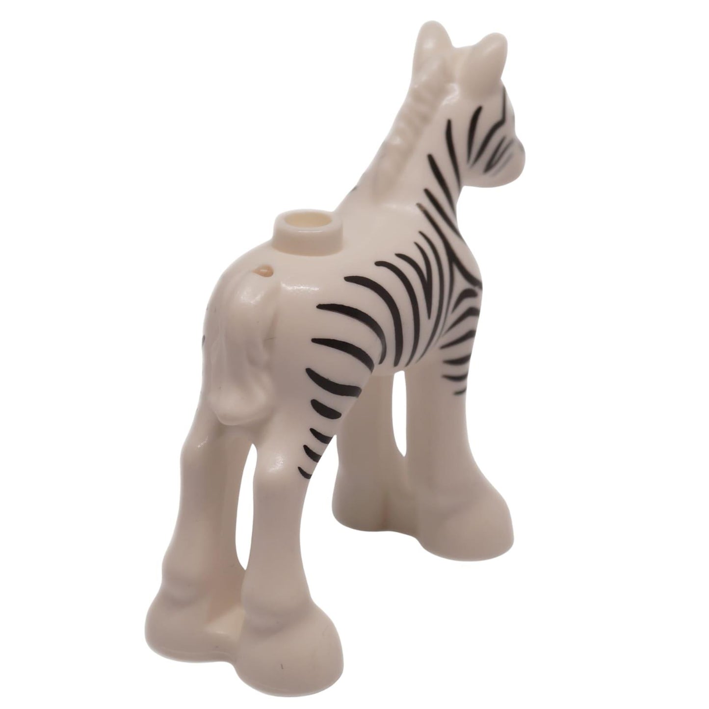 Blanco potro de cebra bebé con rayas negras, vista desde atrás a la derecha figura de animal pequeña
