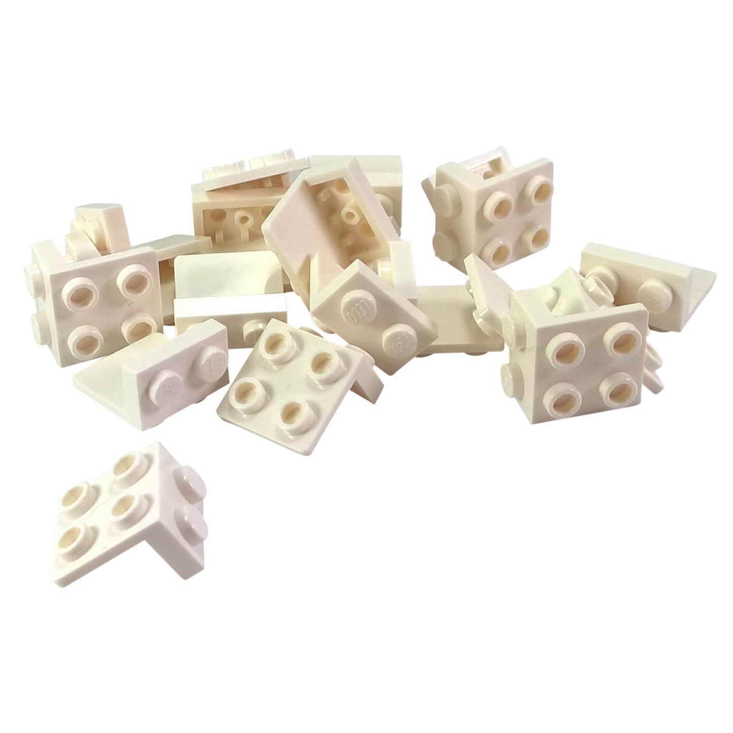 Pile of white LEGO Bracket 1x2 - 2x2 pieces (44728) with one piece separated at the bottom left.