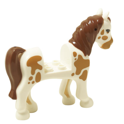 White horse figure back view with brown spots and reddish brown mane tail
