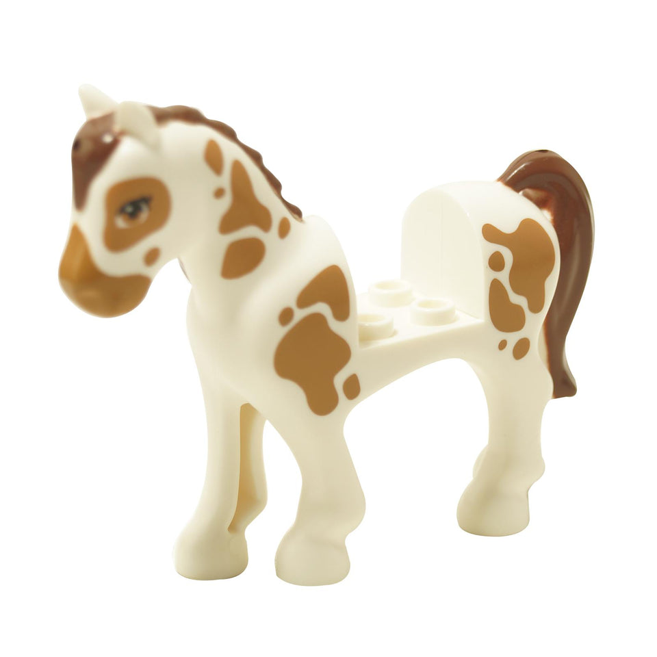 White horse figure with brown spots reddish brown mane tail and medium nougat eyes
