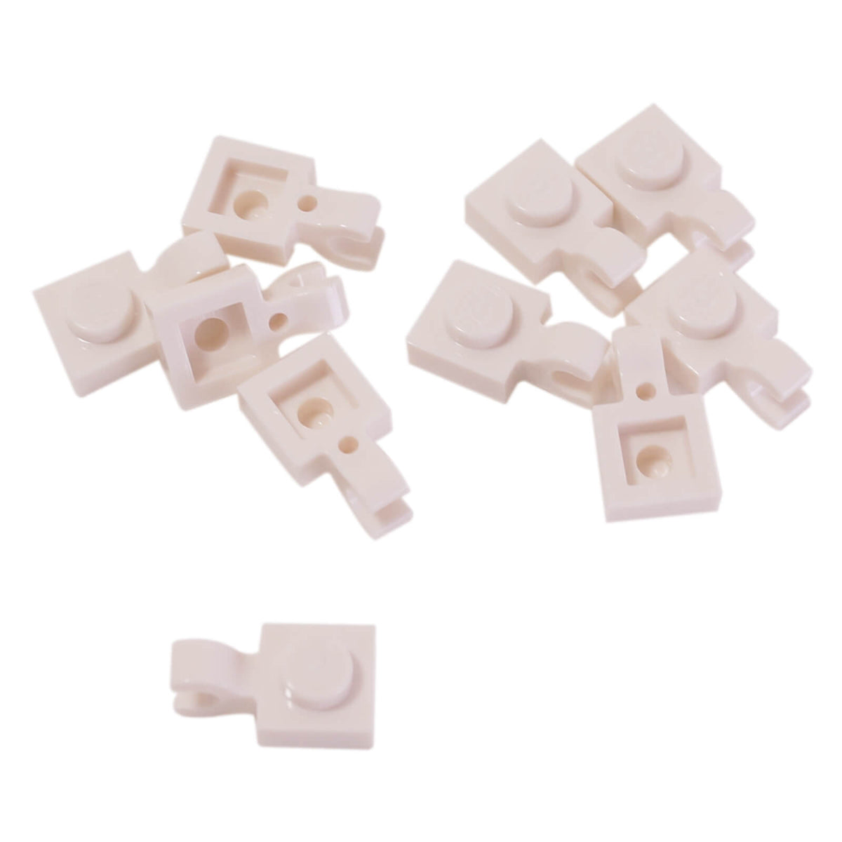 White LEGO® modified plate 1 x 1 part 61252 shown from two angles with single stud and open horizontal O clip