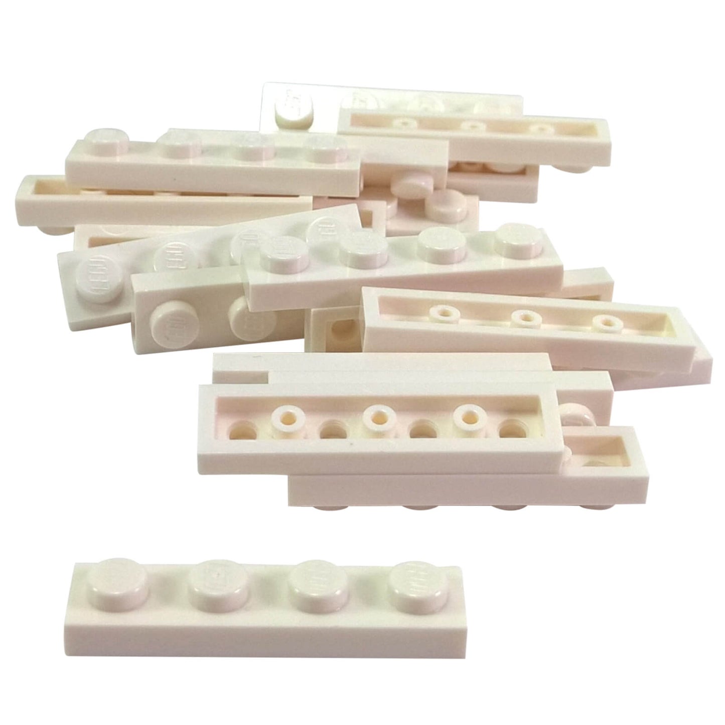 White 1x4 plate building piece with four studs for detailed minifigure scale builds
