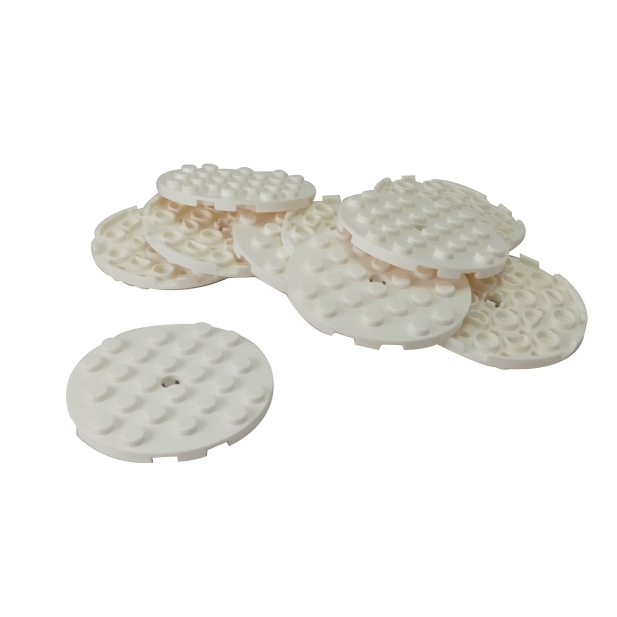 White LEGO® Round Plate 6 x 6 part 11213 shown from the top and underside with studs and a central hole