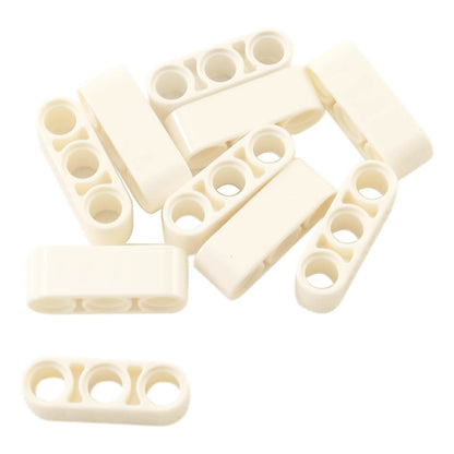 Pile of white LEGO Technic 1x3 Thick Liftarm pieces (32523) loosely grouped.
