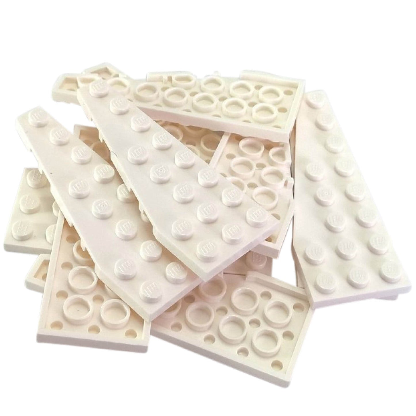 Pile of white LEGO Wedge Plate 8x3 Left pieces (50305) showing studded tops and anti-studs.