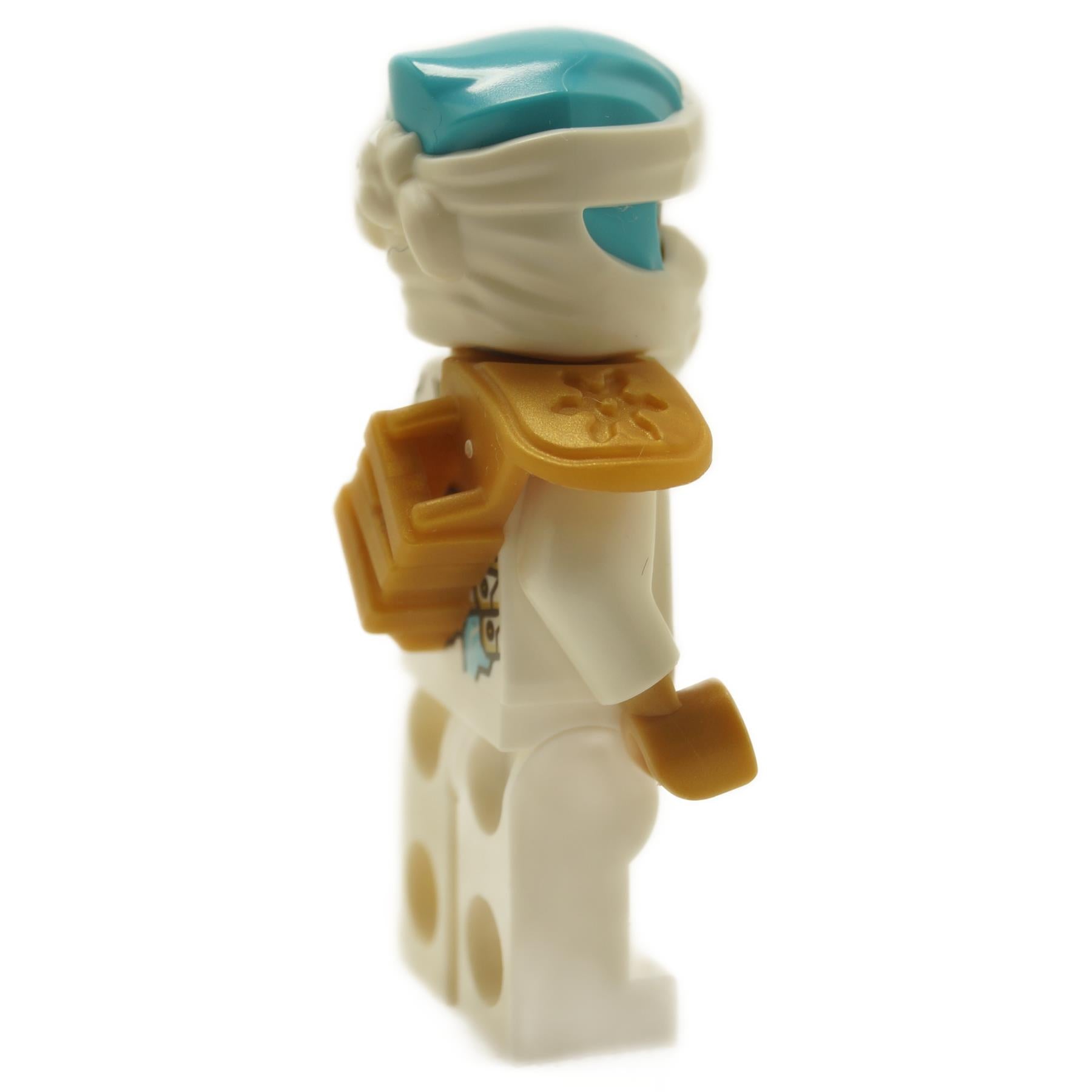 Side view of white Zane minifigure with teal head wrap and golden shoulder armor

