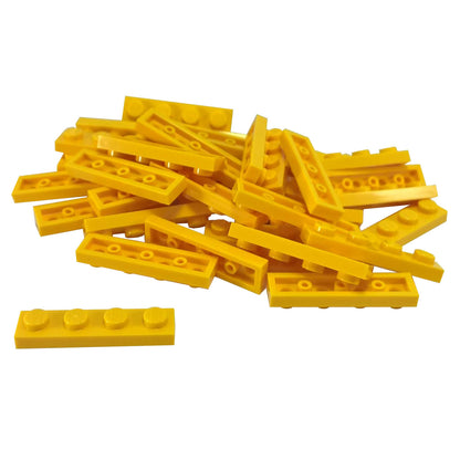 Yellow 1x4 plate building piece with four studs for detailed minifigure scale builds
