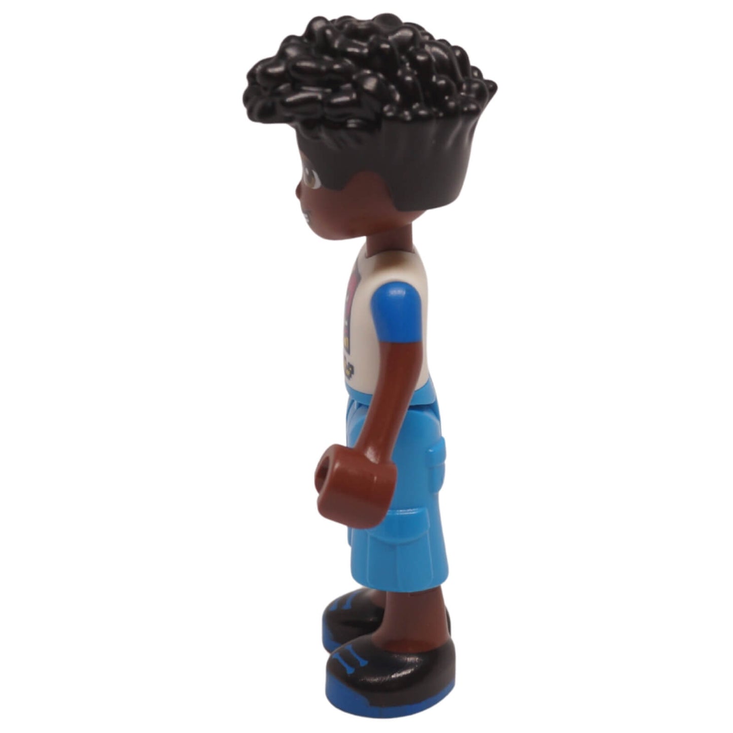 Zac mini doll side view with curly black hair, racer print shirt, blue shorts and black shoes
